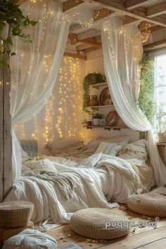 a bedroom with white curtains and lights on the ceiling