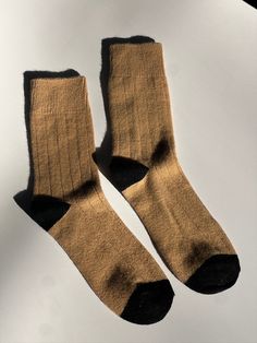 Crafted from a blend of sumptuous cashmere and superfine wool, these vintage-inspired trouser socks boast a wide rib detailing and tonal contrasting heel and toe. Perfect for the autumn and winter seasons, these socks make a thoughtful gift for yourself or a loved one. Made in Korea Classic Cashmere Socks For Winter, Classic Fall Cashmere Socks, Classic Brown Socks For Fall, Classic Fall Socks, Brown Ribbed Winter Socks, Classic Mid-calf Fall Socks, Cashmere Socks, Trouser Socks, Affordable Gifts