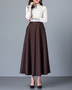 * A high-end long wool skirt with wide hem, very cool. * Made of wool blends, fully lined and with two side pockets. * Fixed waist on front, partial elastic waist on back and side invisible zipper. * Can custom make waist size and skirt length. * Material: Outer-50% wool, 50% polyester; lining-100% polyester * Washing instructions: Dry Clean Only * Size: True to US size, US 0-US 20 are available, you can let us know your usual size and height in your order. * Shipping: Free shipping Processing t Brown Maxi Skirt For Workwear And Fall Season, Brown Flared Maxi Skirt For Fall, Beige Maxi Skirt With Pockets For Fall, Brown Maxi Skirt For Workwear In Fall, Brown Relaxed Maxi Skirt For Work, Brown Lined Maxi Skirt For Work, Brown Flared Maxi Skirt For Work, Brown Full Skirt Bottoms For Winter, Long Fall Skirt With Pockets