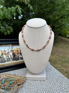 The Buckaroo Necklace *17 1/2" with a 2" extender *4mm Torpedo/Melon beads *6mm Saucers *Spiny Oyster *Sterling Silver hardware *Stainless steel extender -This is made with sterling silver including the Navajo Pearls.  *This listing is for one necklace. Southwestern Orange Round Bead Necklaces, Southwestern Orange Round Bead Jewelry, Southwestern Orange Round Beads Jewelry, Southwestern Orange Round Beads Necklace, Southwestern Orange Beaded Necklace, Spiny Oyster Jewelry, Navajo Pearls, Spiny Oyster, Western Jewelry