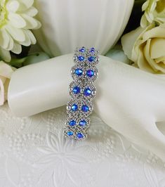 Handmade Blue Crystal Beaded Bracelets, Blue Crystal Beaded Bracelets For Jewelry Making, Handmade Blue Crystal Bracelet, Silver Crystal Beaded Jubilee Bracelets, Blue Jubilee Crystal Bracelet With Round Beads, Handmade Silver Crystal Beaded Bracelets, Woven Bracelet, Beaded Crafts, Box Clasp