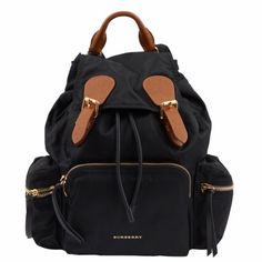 Burberry Prorsum Black Rucksack With Tan Textured Leather Details And Gold Tone Metal Hardware. A Handle, Adjustable Ribbons And Chain Shoulder Straps. Shoulder Straps 76cm, Handle Height 4cm. Burberry Backpack, Black Rucksack, Luxury Backpack, Burberry Prorsum, Metal Hardware, Burberry Bag, Gold Tone Metal, Shoulder Straps, Burberry