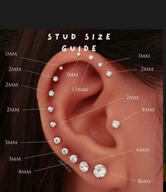 the side view of a woman's ear with different size and shape studs