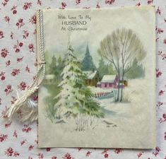 an old fashioned christmas card with a house in the background