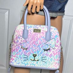 Luv Betsey Johnson Lini Dome Pastel Kitty Cat Print Bag Nwt Gorgeous Bag For Spring Or Easter Beautiful Pastel Colors: Pink, Purple, Green, Blue A Crossbody For Every Occassion, The Luv Betsey Lini Dome Handbag Is Just The Right Size And Style To Be Taken On Any Exciting City Adventure You May Encounter. Kitty Cat Face Details On Bag. Crossbody Strap. Top Zipper Closure. Handles For Easy Carry. Roomy Interior. Gold Tone Hardware. Constructed Of Pu (Polyurethane). 100% Polyester Lining. Approxima Cute Purple Satchel Bag, Playful Purple Bag For Everyday Use, Trendy Pink Cat Design Bags, Playful Multicolor Bags With Cat Design, Pastel Kitty, Betsy Johnson Bags, City Adventure, Coco Chanel Mademoiselle, Vintage Leather Handbag