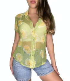 90’s sunflower sheer shirt Brand: InCharge super cute button down modeled with a white push up bra under perfect for summertime with your favorite pair of denim shorts Summer Blouse With Button Closure, Trendy Summer Blouse With Button Closure, Y2k Style Button-up Summer Tops, Retro Summer Button-up Blouse, Retro Button-up Summer Blouse, Fitted Sunflower Print Top For Summer, Fitted 90s Inspired Summer Tops, Fitted Y2k Summer Blouse, Fitted Y2k Style Summer Blouse