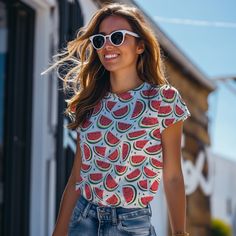 Get ready to slice into summer fun with our Watermelon Wonderland Tee! 🍉🌞 Embrace the sweet, juicy vibes as you don this shirt adorned with a mouthwatering array of watermelon wedges, bursting with vibrant colors and refreshing flavor! 🌈🍉 Whether you're a fruit fanatic, a lover of summertime bliss, or simply seeking a tee that's as cool as a slice of melon on a hot day, this design is your perfect match. Crafted from premium fabric and featuring a print that's as refreshing as a dip in the pool, it's the ultimate choice for those who want to add a splash of sweetness to their wardrobe. So grab a slice, soak up the sun, and let the Watermelon Wonderland Tee be your stylish companion for a summer adventure like no other! 🌟🍉 * 95% polyester, 5% elastane (fabric composition may vary by 1 Trendy Green T-shirt For Summer, Playful Red T-shirt For Summer, Red Strawberry Print Top For Summer, Spring Tops With Fruit Print, Playful Red Summer Tops, Playful Red Tops For Summer, Red Fruit Print Tops For Summer, Fruit Print Tops For Beach In Spring, Playful Beach T-shirt For Spring