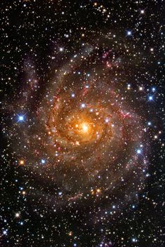 an image of a spiral galaxy in the sky with stars all around it, taken from space