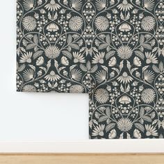 two black and white wallpapers with floral designs on them, one in the middle