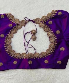 Hand embroidered ready made saree blouse / crop top/stitched saree blouse usa / purple U neck  saree blouse/ hand embroidered blouse/zardosi blouse/U neck  saree blouse/ purple pure silk blouse/ maggam work blouse        It is very true that a perfect blouse is the one which makes your saree look stand out !! If you find one of such a style that you have been wanting to have then dont let it go !! we carry such unique trending blouses that instantly add a stylish look to any saree !!     Well..!! we understand that you may not get in your desired size/pattern, here you go with customization according to your size/pattern which we can deliver in 1-2 weeks of time period !!      Here is a beautiful Hand embroidered saree blouse in purple color that has simple cutwork embroidery on necks and Cheap Bohemian Blouse With Zari Work, Simple Handwork On Blouse, Luxury Purple Embroidered Blouse Piece, Silk Sari Blouse Designs Latest, Purple Embroidered Art Silk Choli, Designer Wear Purple Blouse With Pallu, Purple Designer Blouse For Diwali, Designer Purple Blouse For Diwali, Purple Bollywood Designer Wear Blouse