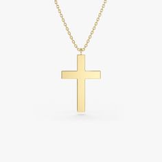 Gold KT: 14K Custom Gold Color: Rose Gold, Yellow Gold, White Gold Cross: 18 x 11 MM This 14k plain gold dangling cross necklace is a simple yet stunning accessory that will add a touch of sophistication to any outfit. The delicate gold chain holds a beautifully crafted cross charm that dances elegantly with every movement. Measuring approximately 18mm in size, this necklace is the perfect size for everyday wear, and the 14k gold construction ensures that it will last for years to come. Cross Charm Necklace, Gold Letter Necklace, Christmas Necklace, Gold Letter, Gold Letters, Gold Cross, Cross Charms, Recycled Gold, Letter Necklace