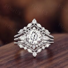 a diamond ring on top of a wooden table