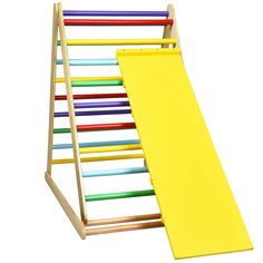 a wooden rack with colored pencils in it and a yellow board on the bottom