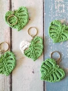 crocheted keychains with heart shaped leaves on them