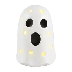 a white light up ghost with black eyes and yellow spots on it's face