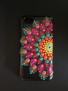 an iphone case with colorful designs on it