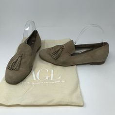 AGL Suede Tassel Slip On Flat Loafers Shoes Beige Try out the tassel trend and look oh-so-polished in this shapely Italian loafer offered in lush kidskin suede. - Cushioned footbed - Flexible sole - Leather upper and lining/leather and rubber sole - Made in Italy Materials UPPER 100% kidskin suede MIDSOLE proprietary cushioning OUTSOLE 90% LEATHER/10% RUBBERLINER LEATHER Comes with original dust bag. [Neuder] Italian Loafers, Shoes Beige, Flat Loafers, Suede Tassel, Slip On Loafers, Loafers Shoes, Loafer Shoes, Loafer Flats, Rubber Sole