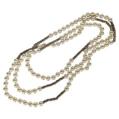 Super Rare and Versatile Chanel Endless Pearl and Crystal Rondel Necklace. Incredibly long and so versatile to wrap or wear singly. Hand knotted faux pearls with gilt bullion caps with hundreds of crystal set rondels. Approx 80". 10 mm faux pearls. Signed. 1990's France. Collar Chanel, Chanel Vintage, Crystal Set, Coco Chanel, Karl Lagerfeld, Faux Pearl, Hand Knotted, Beaded Necklace, Jewelry Necklaces