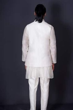 Ivory bundi jacket embroidered with a border of mirror work. Comes with an organza inner kurta with bordered sleeves and coordinating solid pant. - Aza Fashions Fitted White Nehru Jacket With Mirror Work, Festive White Nehru Jacket With Mirror Work, Traditional White Nehru Jacket With Mirror Work, White Nehru Jacket With Cutdana, White Bandhgala With Mirror Work For Eid, White Fitted Nehru Jacket With Cutdana, White Fitted Nehru Jacket For Transitional Season, White Nehru Jacket With Cutdana For Festive Occasions, Fitted White Nehru Jacket For Festive Occasions