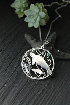 ITEM DESCRIPTION: The size of the pendant - H 4 х W 4 cm (1 1/2 x 1 1/2 inches), weight 8g. Jewelry will come to you in a gift box - ready for gifting. I made this motherhood jewelry of sterling silver, hydrothermal emerald, and topaz London. This unique necklace looks so touching. This is a story of the relationship between parents and children. It is not easy. But this is important for each of us. I hope this wire wrapped necklace will be a wonderful gift for someone whole you love: for your m Sterling Silver Locket Jewelry As Gift For Mom, Personalized Amulet Jewelry For Collectors, Handmade Symbolic Jewelry For Mother's Day, Symbolic Handmade Jewelry For Mother's Day, Spiritual Pendant Jewelry For Mother's Day, Handmade Medallion Necklace For Mother's Day, Personalized Pendant Jewelry Collectible, Pendant Locket Jewelry Gift For Mom, Personalized Pendant Jewelry