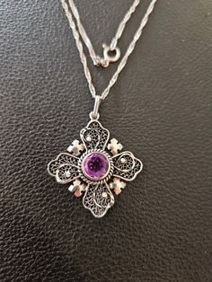 "Jerusalem Cross with Amethyst center stone set in a filigree sterling silver setting.  The cross is marked \"Jerusalem\" and \"950\".   The 950 is a purer form of silver than the standard 925 sterling silver.  It comes with a 21 inch Singapore chain necklace." Purple Sterling Silver Filigree Jewelry, Sterling Silver Jewelry With Intricate Design In Purple, Sterling Silver Purple Jewelry With Intricate Design, Purple Sterling Silver Jewelry With Intricate Design, Purple Filigree Pendant Jewelry, Ornate Silver Amethyst Necklace, Amethyst Filigree Pendant Jewelry, Vintage Cross Necklace, Prayer Jewelry