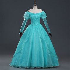 a blue ball gown with long sleeves