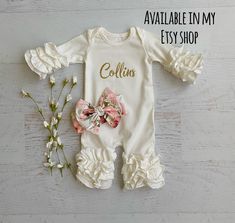 "Listing is for a cute cream colored romper with a dusty pink floral bunny on it. *You can choose to have a name at check out. *You can choose to have the matching headband at check out. This romper has a cute floral dusty pink vinyl bunny and your child's name going across the bunny in gold glitter or gold matte There are 2 bunnies to choose from. Please lmk which one you would like If you do not want the name on the romper just mark no personalization Please don't hesitate to ask if you have q Spring White Ruffled Onesie, Cute White Onesie With Ruffles, Cute White Ruffled Onesie, Cute Cream Onesie For Spring, What Your Name, Navy Blue Girls Dress, 2 Bunnies, Shark Dress, Water Color Floral