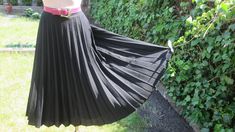 "This pretty pleated skirt vintage is perfect for spring, autumn and summer! DETAILS: rare skirt vintage skirt made in West Germany skirt midi pleated skirt fabric: wool;  polyester color: black side zipper almost circle skirt skirt with lining Very good condition. Measurements lying flat are: Length: 28,5\" / 72cm Waist: 14\" / 35,5cm PLEASE NOTE: \"Laying flat\" means that waist  NEED TO DOUBLED Estimated size: EUR42 / UK14, but refer to measurements  Belt in photo is not included." Black Vintage Pleated Skirt, Vintage Black Pleated Skirt, Vintage Full Skirt With Accordion Pleats, Vintage Pleated Lined Skirt For Spring, Spring Vintage Flared Pleated Skirt, Vintage Black Flared Skirt, Retro Black Pleated Skirt, Spring Vintage Long Pleated Skirt, Vintage Long Pleated Skirt For Spring