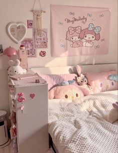 there is a small child's bedroom with pink decorations on the wall and bed