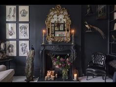 a living room filled with furniture and a fire place in front of a wall mounted mirror