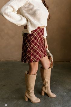 The Amira Burgundy Multi Plaid Skirt is a timeless piece with a modern twist. Featuring a rich burgundy, brown, and cream plaid print, this skirt adds a bold, classic pattern to your wardrobe. The frayed hemline brings an edgy detail to the design, while the side monochrome zipper with hook closure ensures a secure and seamless fit. Perfect for pairing with sweaters or blouses, the Amira skirt is versatile enough for both casual outings and more polished looks, making it a must-have for any seas Edgy Fitted Plaid Skirt, Plaid Skirt Brown, Trendy Plaid High-waist Mini Skirt, Maroon Plaid Skirt, Edgy Plaid Mini Skirt, Faux Leather Purse, White Bodycon Dress, Travel Dress, Jumpsuit Shorts Rompers