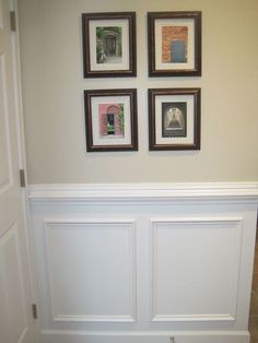 three framed pictures hang on the wall above a toilet