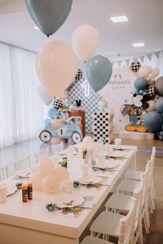 a table set up for a baby's first birthday party