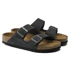 An icon of timeless design and legendary comfort, the Arizona sandal has been defining style since 1973. Handcrafted for quality, oiled nubuck leather looks distinctly heritage, designed to age over time for a perfectly worn, one-of-a-kind look. Featuring an additional foam layer for cushioning, the soft footbed offers extra comfort plus go-all-day support.   Cushioned BIRKENSTOCK soft footbed creates custom support with wear Oiled leather upper, colors may vary Suede footbed lining helps keep you comfortable EVA sole is flexible and lightweight  Two adjustable straps with metal pin buckles “Made in Germany” quality stamp on footbed Black Birkenstock, Birkenstock Men, Tokyo Street Fashion, Birkenstock Sandals Arizona, Birkenstock Black, Two Strap Sandals, Simple Sandals, Estilo Hippie, Footbed Sandals