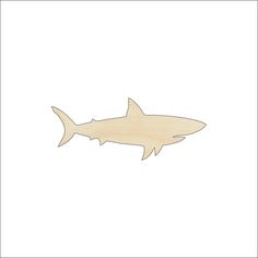 a wooden cutout of a shark on a white background