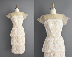 "Outstanding vintage 1950s cocktail party dress by Irene Sargent. This vintage dress features a wonderful Chantilly lace over lace with a gorgeous tier pencil skirt. The bodice is well fitted with bust darts, nipped waist, and a back metal zipper for closure. ✂------ M E A S U R E M E N T S ------- Best Fit: Small Bust: 32.5/33\" Waist: 24.5/25\" Hips: 37.5\" Shoulders: undefined Sleeves: 3.5\" Total Length: 44.5\" Tag/Label: Irene Sargent Material: Chantilly lace, silk Condition: Excellent vint Cream 1950s Style Dresses, White Fitted 1950s Vintage Dress, 1950s Cocktail Party, 1950s Style Fitted Cream Vintage Dress, Retro Vintage Cream Dress With Lace Trim, 1950s Fitted Dress With Lace Trim, Wedding Dresses 50s, 1960s Dresses, Shirt Dress Summer