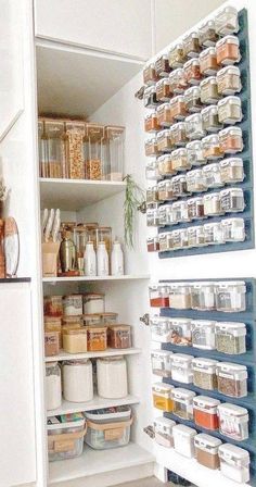 an organized pantry with lots of containers and food in the shelves, along with other items