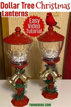 two red glass vases sitting on top of a table