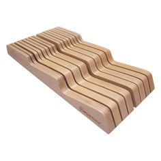 a set of five wooden coasters with wavy lines on the top, and bottom