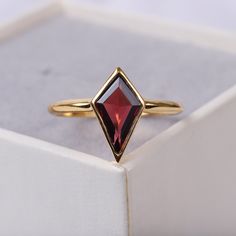 Vintage Antique Garnet Ring, 14k Solid Gold, Art Deco Kite Shaped Garnet Purpose Ring, Wedding Ring, January Birthstone, Anniversary Gift Main Stone: Garnet Main Stone creation- Lab Created Main Stone Size: 7x12mm Main Stone Color: Red Main Stone Shape: Kite Birthstone Month: January Jewelry Type: Wedding ring Metal: 14k Rose Gold \925 Sterling Silver Method: Cast Personalization: Possible Occasion: Engagement Style: Ring Size: We make rings from US 4 to US 10. (If you need smaller or bigger rin Art Deco Jewelry Rings Gold, Formal Garnet Crystal Ring, January Jewelry, Kite Shaped Engagement Ring Vintage, Unique Garnet Ring, Vintage Garnet Ring Gift, Red Garnet Crystal Ring With Gemstone, Kite Stone Ring, Garnet Wedding Rings