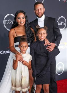 the couple and their two children are posing on the red carpet at an espy awards event