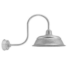 an old fashioned wall light with a metal shade on the side and one arm extended