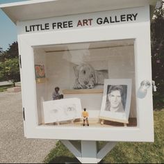 there is a little free art gallery in the box with pictures and dolls on it