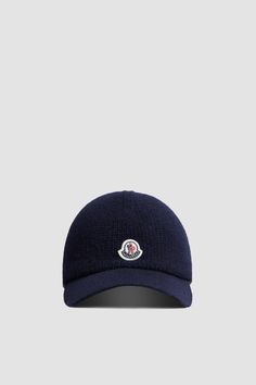 A casual staple, the baseball cap is reimagined for a refined everyday wardrobe in knit cotton. The accessory is completed by a logo patch. Classic Hats With Logo And Curved Visor, Classic Hats With Logo Detail And Curved Visor, Classic Hat With Logo Detail And Curved Brim, Classic Hat With Logo And Curved Brim, Classic Hat With Curved Brim And Logo Detail, Classic Cap With Logo Detail, Casual Hat With Logo And Curved Brim, Casual Cap With Logo Detail, Casual Baseball Cap With Logo Detail