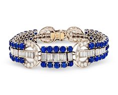 The chic sophistication and glamour of the Art Deco period comes alive in this breathtaking sapphire and diamond bracelet. An impressive 25.00 combined carats of royal blue cabochon sapphires join dozens of sparkling white diamonds totaling 9.45 carats. Crafted of platinum, its eye-catching, geometric setting completes this incredible design.Circa 19307 1/4" length Luxury Sapphire Art Deco Diamond Ring, Luxury Sapphire Art Deco Jewelry, Luxury Art Deco Multi-stone Sapphire Ring, Luxury Art Deco Jewelry With Gemstone Accents, Luxury Art Deco Jewelry With Hand-set Details, Luxury Art Deco Sapphire Ring, Luxury Silver Art Deco Jewelry, Luxury Art Deco Marquise Jewelry, Luxury Gia Certified Art Deco Jewelry