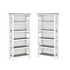 two white shelves sitting next to each other