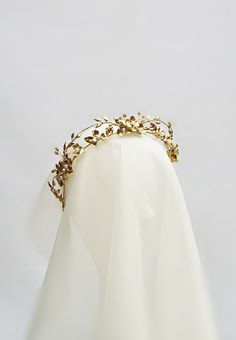 "This golden headpiece is designed for the modern bride. Looks beautiful worn at weddings, anniversaries and many other special occasions. Features: - Leaves and flowers have been individually hand mane with added assorted pearl colour and gold beads - Gilded and Sealed with a hard glossy finish for durability Approximate Measurement: 2.3\" tallest point when worn ------------------------------------------------- *Disclaimer: Due to the handmade nature of this product each headpiece is truly uni Bride Tiara Gold, Ivory And Gold Crown, Goddess Bridal Tiara, Gold Bridal Hair Piece, Wedding Crown Gold, Golden Headpiece, Gold Bridal Tiara, Bridal Circlet, Ocean Forest