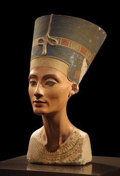 an ancient statue of the egyptian queen nefere with her head turned to look like she is wearing a hat