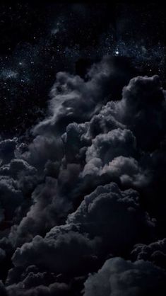 the night sky is filled with clouds and stars