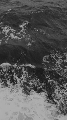 black and white photo of waves in the ocean